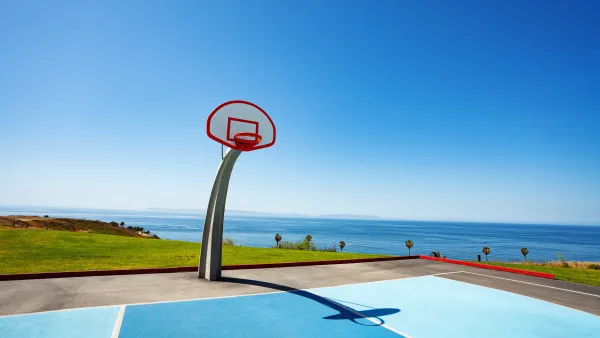 Beachside basketball couty with ocean view and blue painted court at Angel Gate Park in Los Angeles, California on a sunny day