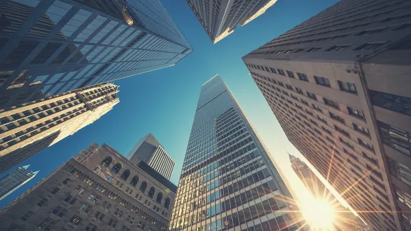 Looking up at high-rise office buildings in New York City.