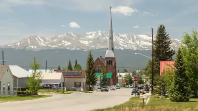 Church with tall steeple in rural Colorado.