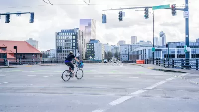 Person on bike in empty intersection in Portland, Oregon.
