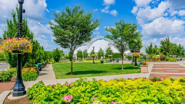 Lush Five Rivers Metropark in Dayton, Ohio with flowers and green trees on a sunny day.
