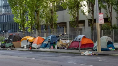 Tents set up by unhoused people on sidewalk in San Francisco, California.