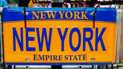 Yellow and blue novelty New York state license plate with NEW YORK plate.