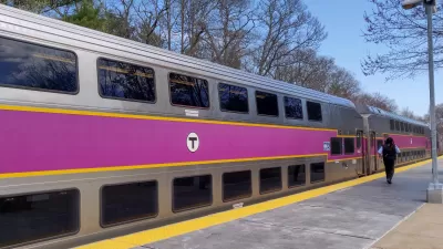 Silver commuter train with purple stripe in Boston, Massachusetts