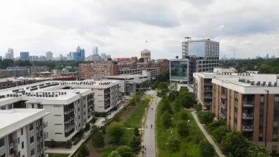 Aerial view of Atlanta BeltLine greenway with multistory buildings one ither side