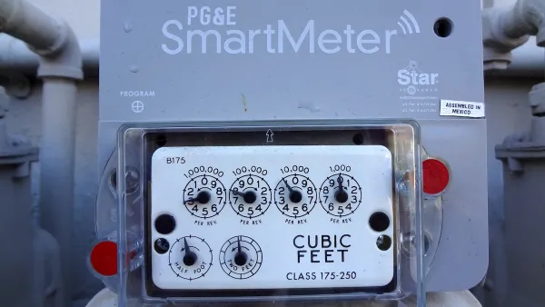 Close-up on PG&E "SmartMeter" electricity meter on side of building.