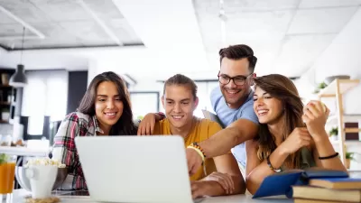 Group of young people enjoying group study at table.
