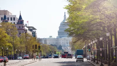 View down Pennsylvania Avenue with U.S. capitol in background and bike lane in middle of street