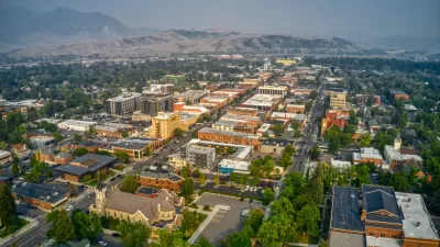 Bird's eye view of downtown Bozeman, Montana, with mountains on the horizon