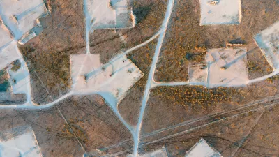 Bird's eye view of oil field in New Mexico desert.