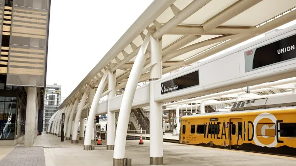 A yellow RTD train at platform at Union Station in Denver, Colorado.