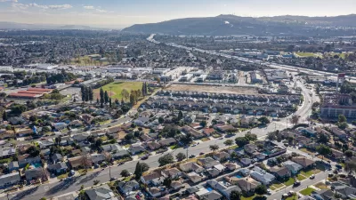 Aerial view of low-rise neighborhood near ocean in South Bay, Los Angeles, California.