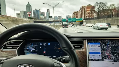 Tesla self-driving car view from inside dashboard.