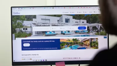 Close-up of computer screen with VRBO short-term rental platform site open.