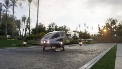 Rendering of small autonomous 'air taxi' parked on gray stone driveway.