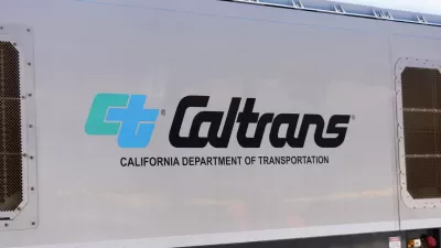 Close-up of Caltrans logo on white passenger train