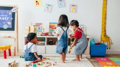 Three toddlers playing in a colorful playroom