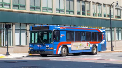 Blue bus on city street