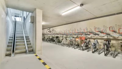 Bike parking in underground area with ramp for taking bikes upstairs.