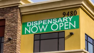 Green "Dispensary Now Open" banner on tan/orange building.
