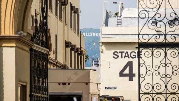 "Stage 4" soundstage wall seen through ornate metal gate at Paramount Studios lot in Los Angeles, California.