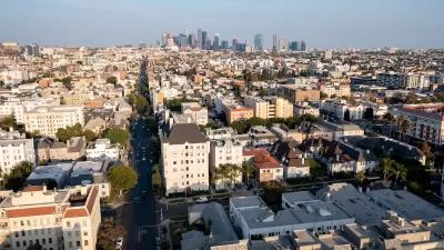 Aerial view of residential buildings in Koreatown, Los Angeles with downtown skyline in background