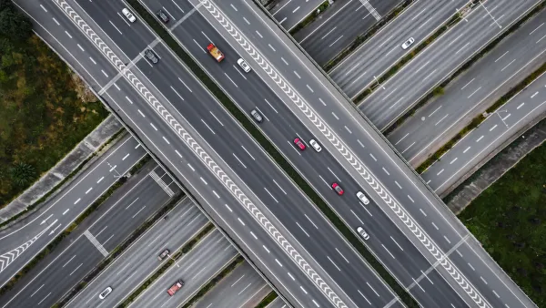 Overhead view of multilane elevated highway with multiple levels.