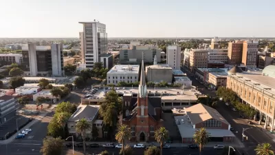 Aerial view of downtown Stockton, California with brick church in foreground.