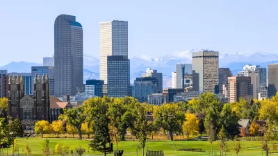 Denver, Colorado skyline with green lawn in the foreground.