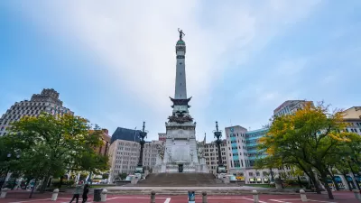 Soldiers and Sailors Monument in traffic circle in Indianapolis at twilight.
