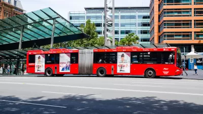 Red articulated public transit bus in Sydney, Australia.