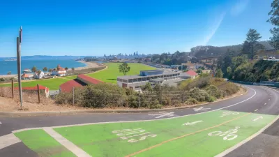 Green painted bike and pedestrian trail with view of San Francisco Bay.