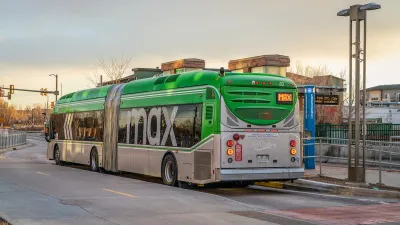 Green and silver Max BRT bus at station in Fort Collins, Colorado.