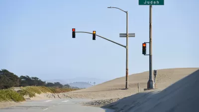 Great Highway roadway on San Francisco coast blocked by sand.