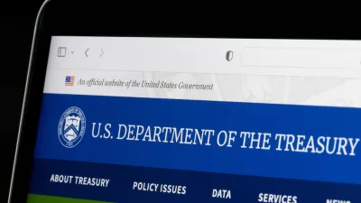 Close-up of laptop screen with U.S. Treasury Dept. website pulled up.
