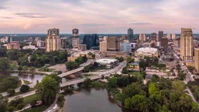 Aerial view of London, Ontario with river in foreground.