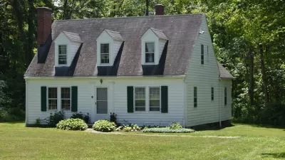 Craftsman-style white kit home from Sears catalog sold in early 20th century