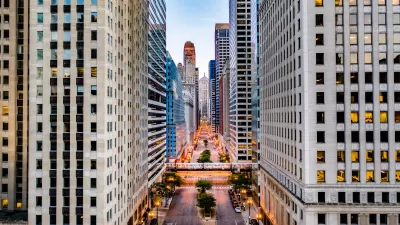 View of down La Salle Street lined with skyscrapers in downtown Chicago.