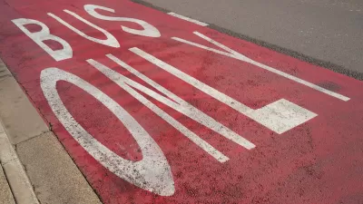 Close-up of red painted Bus Only lane.