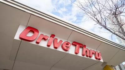 Close-up of red DriveThru sign at McDonald's fast food restaurant in Chicago, Illinois.