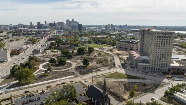 Aerial of construction site in front of historic multi-story Michigan Central train station in Detroit, Michigan.