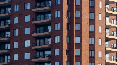 Close-up of facade of red brick high-rise apartment building in Columbus, Ohio.