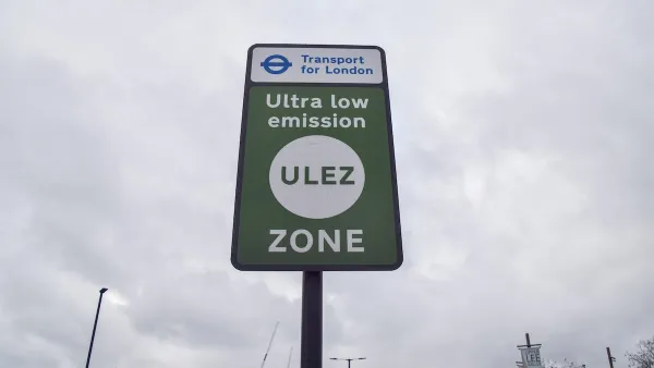 Close-up of green "Ultra low emission zone" ULEZ sign in London, UK.