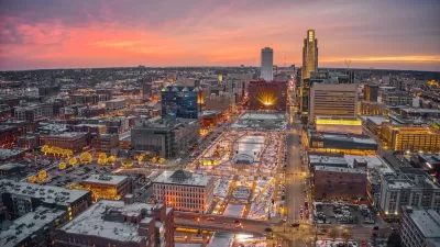 Aerial view of downtown Omaha, Nebraska with holiday lights at sunset.