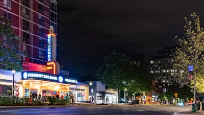 Night view of vintage theater with neon marquee in Bethesda, Maryland.