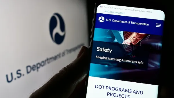 Close-up of smart phone with USDOT website open.