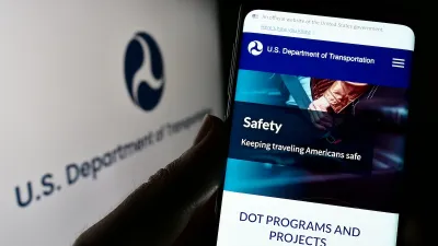 Close-up of smart phone with USDOT website open.