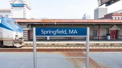 Springfield, MA outdoor Amtrak station platform with train pulling in.