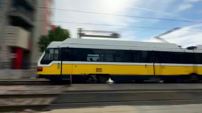 Blurred image of speeding DART light rain train in Dallas, Texas