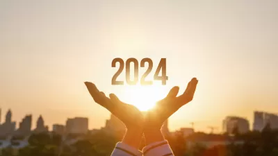 Graphic of person's hands with 2024 in middle against backdrop of city skyline and golden hour sky with rays coming through.